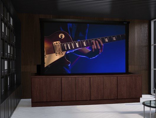 The screen surface rises out of a floor mounted enclosure
